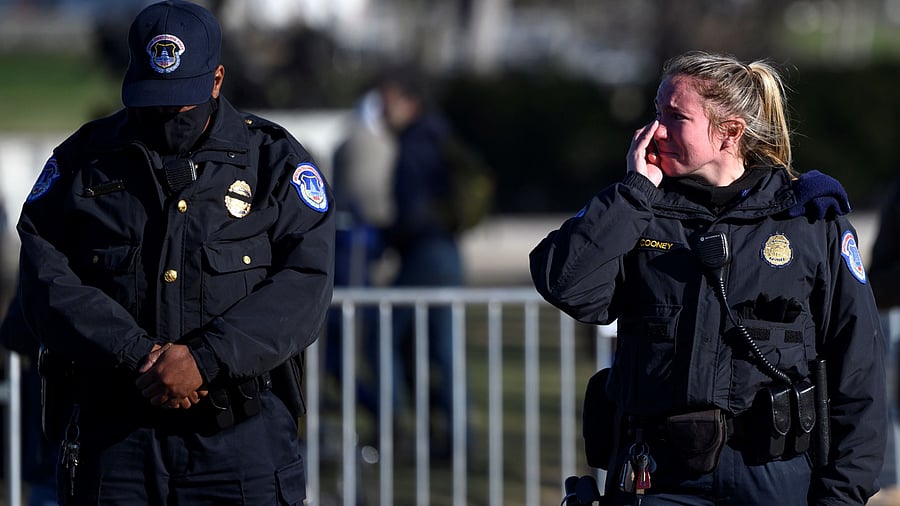 US Capital police react after the casket with fallen police officer, Brian Sicknick, passed during a funeral procession in Washington. Credit: AFP Photo