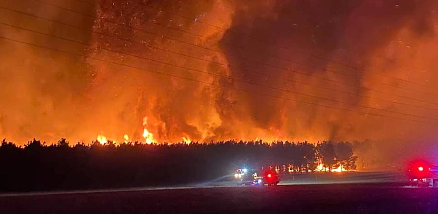 Smoke and flames from bushfire are seen in Gingin, Australia. Credit: Reuters Photo