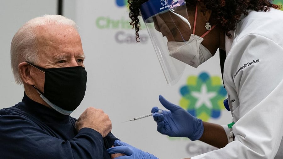 US President-elect Joe Biden receives a Covid-19 vaccination from Tabe Mase, Nurse Practitioner and Head of Employee Health Services, at the Christiana Care campus in Newark, Delaware. Credit: AFP.