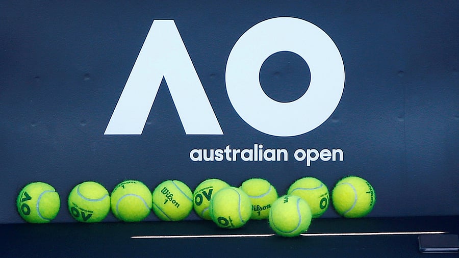 Tennis balls are pictured in front of the Australian Open logo before the tennis tournament. Credit: Reuters File Photo