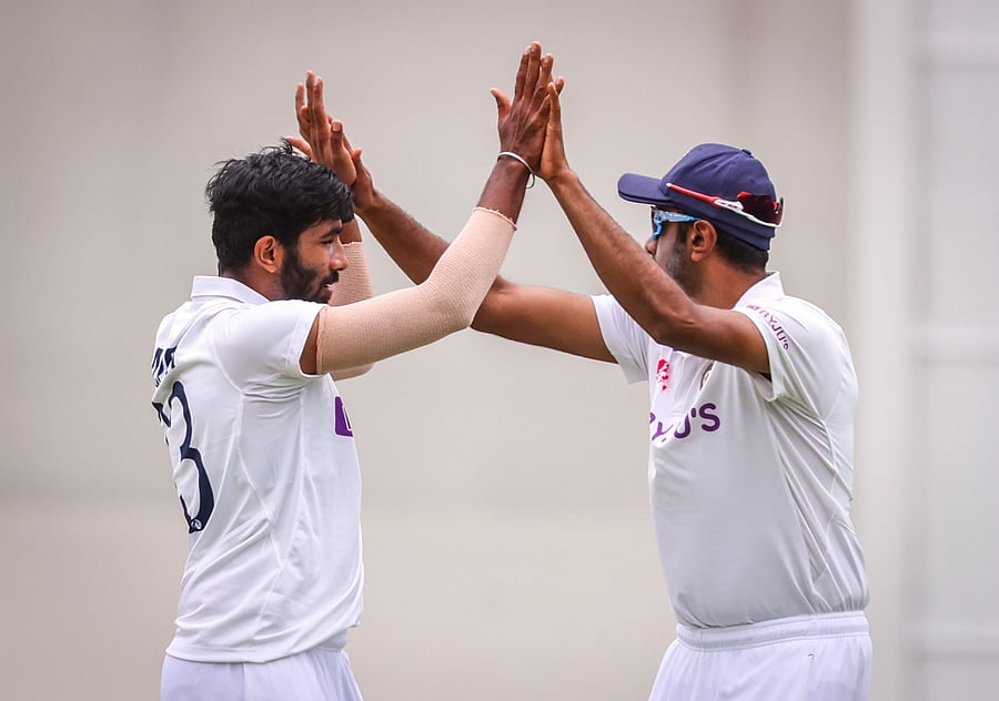 India's Jasprit Bumrah (L) celebrates with team mate Ravichandran Ashwin. Representative image/Credit: AFP Photo