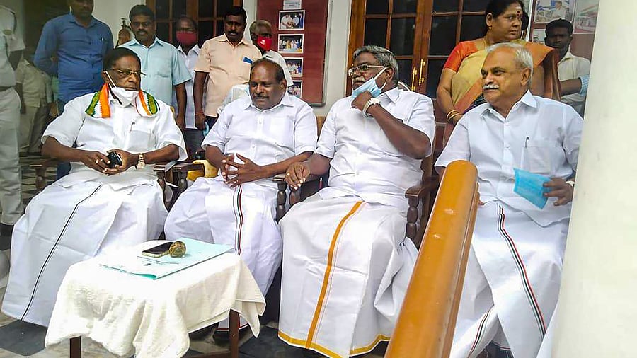 Puducherry Chief Minister V Narayanasamy (L) during a meeting with Welfare Minister M Kandasamy (2L), who is on a indefinite protest at the Assembly over alleged delay by Lt. Gov. Kiran Bedi in approving his files, in Puducherry. Credit: PTI Photo