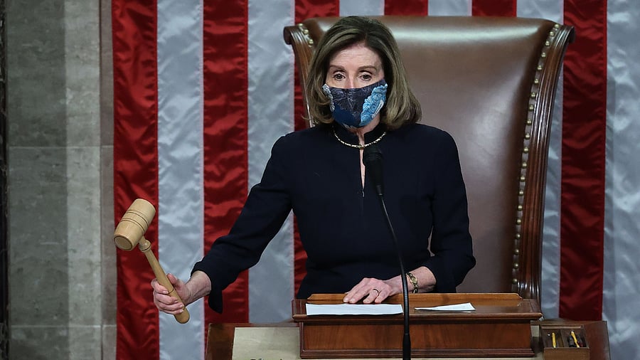 Speaker of the House Nancy Pelosi (D-CA) raps her gavel after the House voted to impeach US President Donald Trump for the second time in little over a year in the House Chamber of the US Capitol in Washington, DC. Credit: AFP Photo
