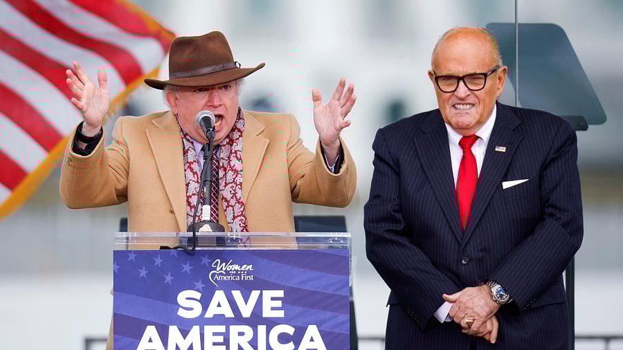 Law professor John Eastman, next to US President Donald Trump's personal lawyer Rudy Giuliani, gestures as he speaks while Trump supporters gather ahead of his speech to contest the certification by the US Congress of the results of the 2020 US presidential election in Washington, US. Credit: Reuters File Photo