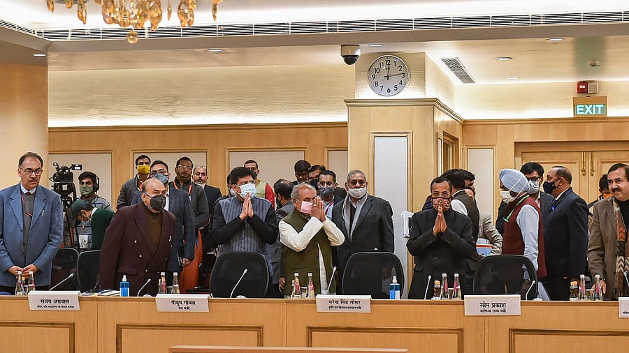 Union Minister for Agriculture and Farmers Welfare Narendra Singh Tomar (4L) along with Union Minister for Commerce and Industry Piyush Goyal (3L) and other dignitaries arrives to hold the ninth round of talks with farmer leaders over the new farm laws. Credit: PTI Photo