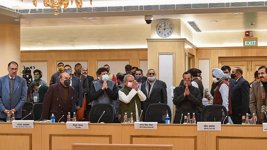 Union Minister for Agriculture and Farmers Welfare Narendra Singh Tomar (4L) along with Union Minister for Commerce and Industry Piyush Goyal (3L) and other dignitaries arrives to hold the ninth round of talks with farmer leaders over the new farm laws, at Vigyan Bhawan in New Delhi. Credit: PTI Photo