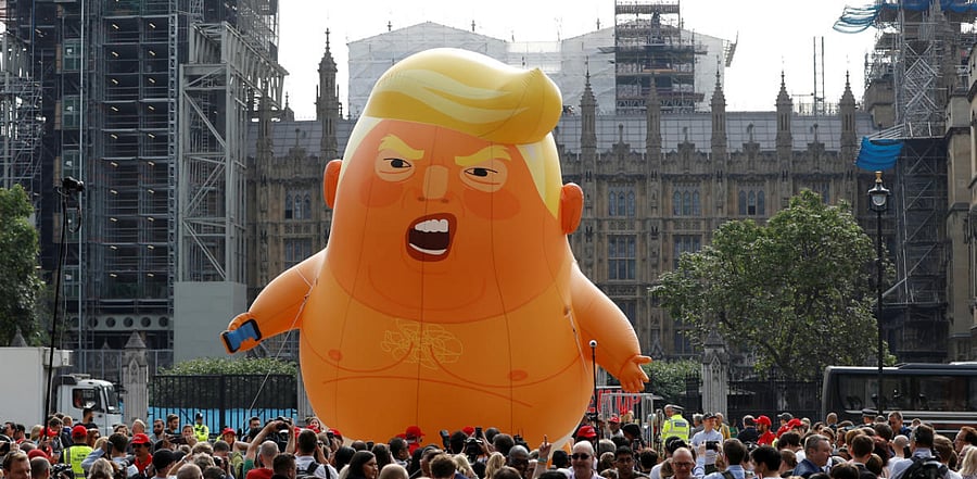 Demonstrators fly a blimp portraying U.S. President Donald Trump, in Parliament Square. Credit: Reuters Photo