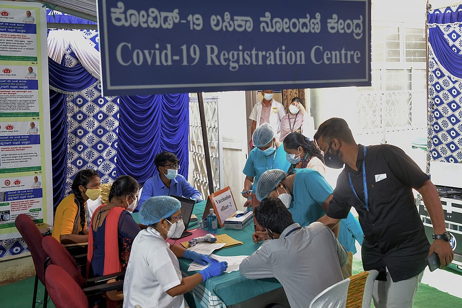 Health workers register to receive the Covid-19 coronavirus vaccine at the KC General hospital in Bangalore on January 16, 2021. Credit: AFP Photo