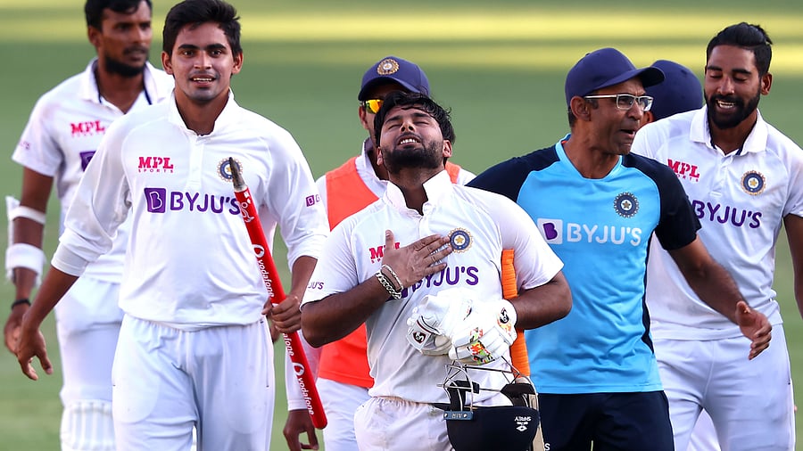 India's batsman Rishabh Pant (C) gestures as team celebrate victory in the fourth cricket Test match against Australia. Credit: AFP Photo