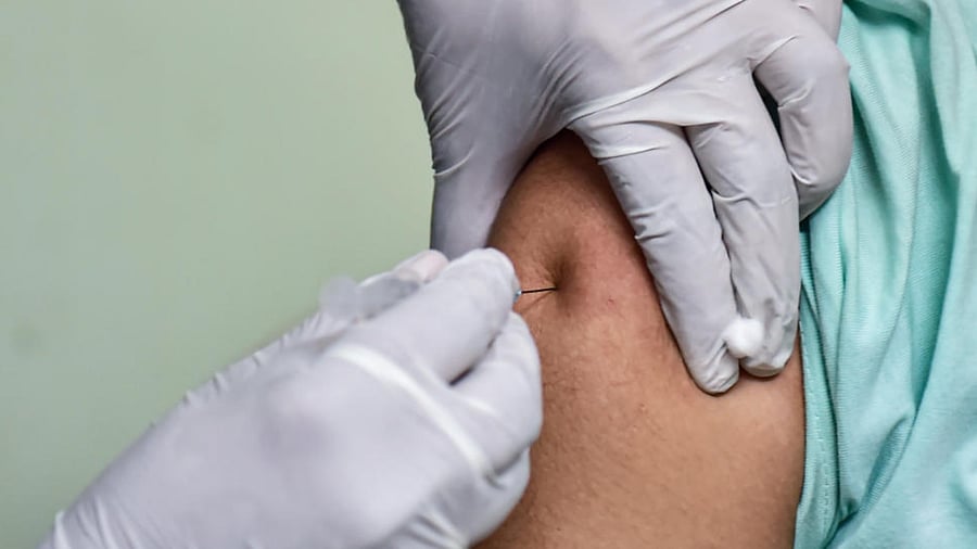  A medic administers COVID vaccine to a medical student during the first phase of the countrywide inoculation drive, in Bengaluru, Tuesday, Jan. 19, 2021. Credit: PTI Photo