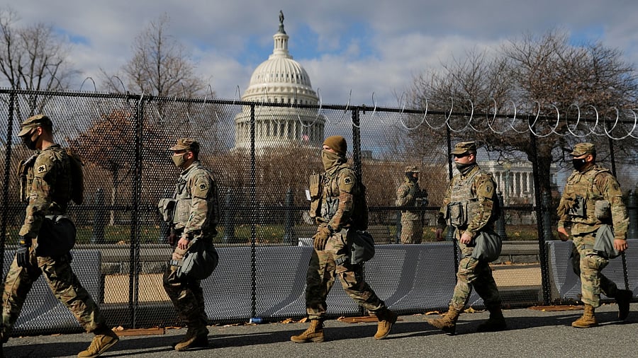 Members of the National Guard patrol near the US Capitol building ahead of US President-elect Joe Biden's inauguration, in Washington, US. Credit: Reuters Photo