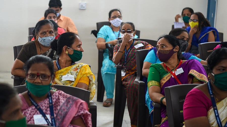 Health workers wait in the observation area after receiving a Covid-19 coronavirus vaccine at the Rajawadi Hospital in Mumbai on January 19, 2021. Credit: AFP Photo
