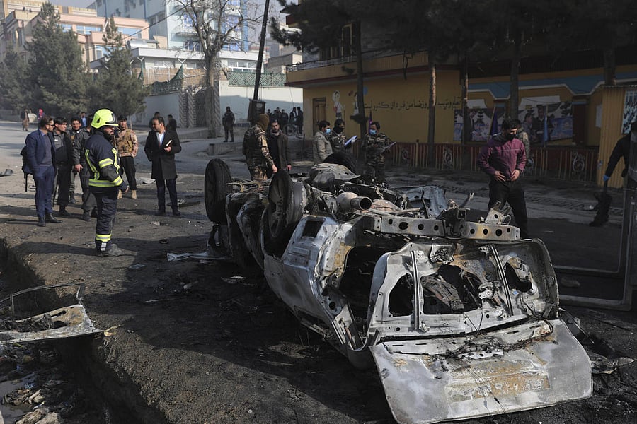 Afghan security officers inspect the site of a bombing attack in Kabul, Afghanistan, Sunday, Jan. 10, 2021. Credit: AP. 