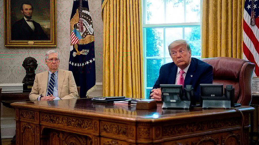Former US President Donald Trump speaks with former Senate Majority Leader Mitch McConnell. Credit: AFP File Photo