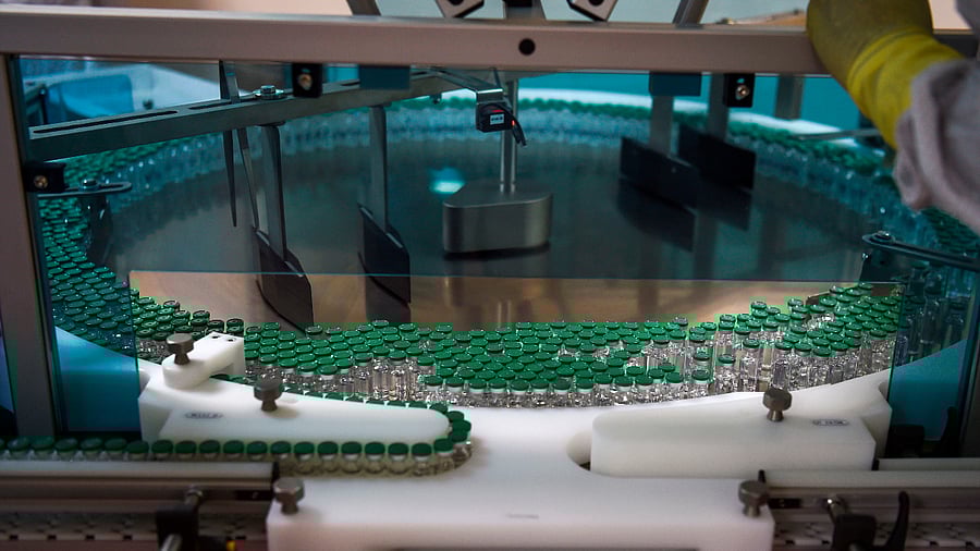 An assembly line for manufacturing vials of Covishield, AstraZeneca-Oxford's Covid-19 coronavirus vaccine is pictured at India's Serum Institute in Pune. Credit: AFP Photo