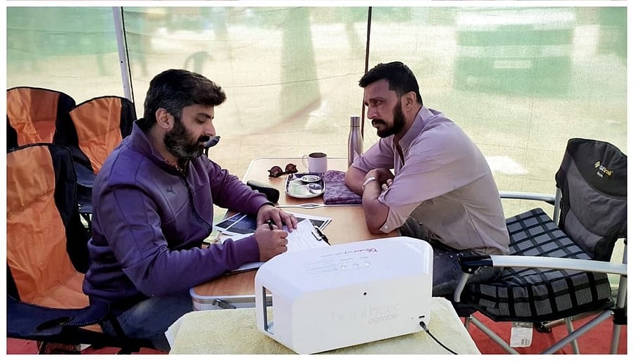 Director Anup Bhandari (left) with Sudeep on the sets of 'Vikrant Rona'. 