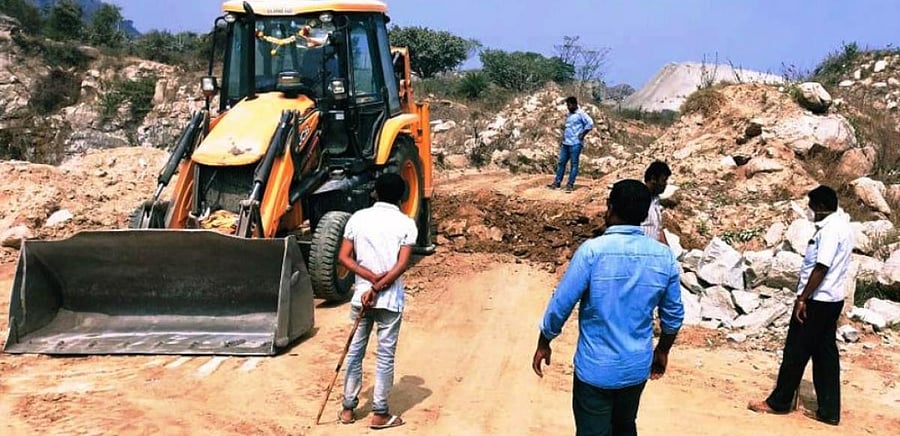The officials raid a quarry at Bebi Betta in Pandavapura taluk in Mandya district on Saturday. DH PHOTO