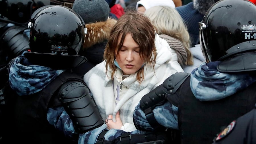 Law enforcement officers detain a woman during a rally in support of jailed Russian opposition leader Alexei Navalny in Moscow, Russia January 23, 2021. Credit: Reuters.
