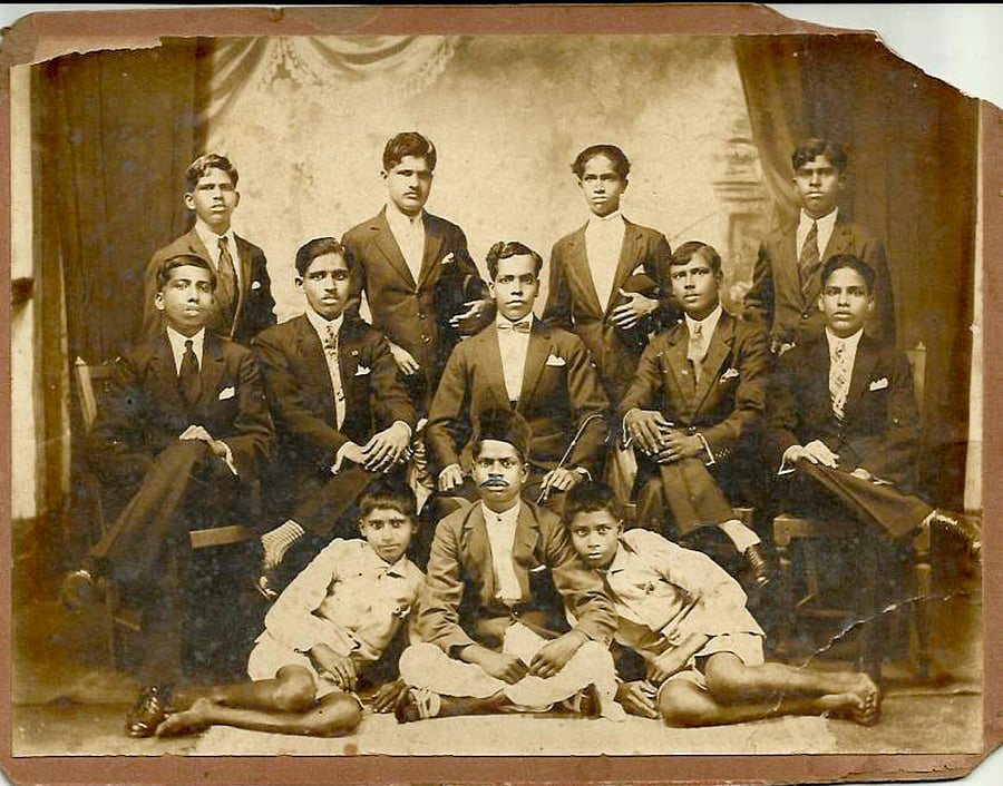 Menino Fernandes (centre) with his staff.
