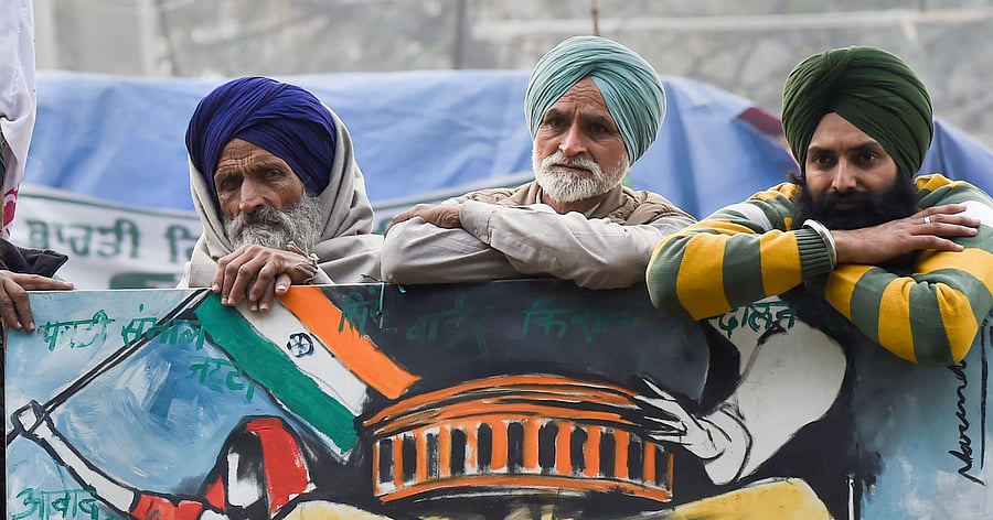 Farmers during their ongoing agitation against the new farm laws, at the Singhu border, in New Delhi, Sunday, Jan. 24, 2021. Credit: PTI Photo