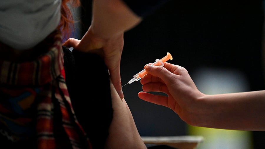 A patient receives an injection of the Oxford/AstraZeneca Covid-19 vaccine at the vaccination centre set up inside Brighton. Credit: AFP Photo