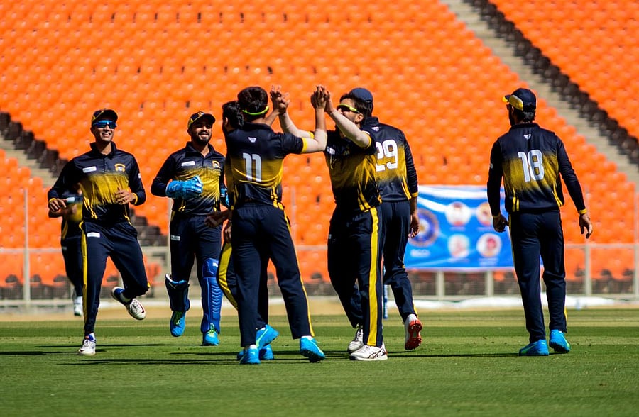 Punjab players celebrate the dismissal of a Karnataka batsman during the quarterfinal in Ahmedabad on Tuesday. TWITTER/BCCI