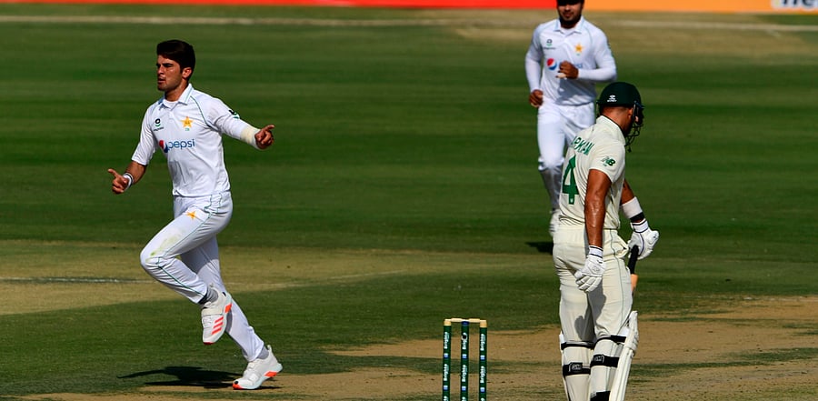 Pakistan's Shaheen Shah Afridi (L) celebrates the wicket of South Africia's Aiden Markram (R) during the first day of the first cricket Test match between Pakistan and South Africa. Credit: AFP Photo