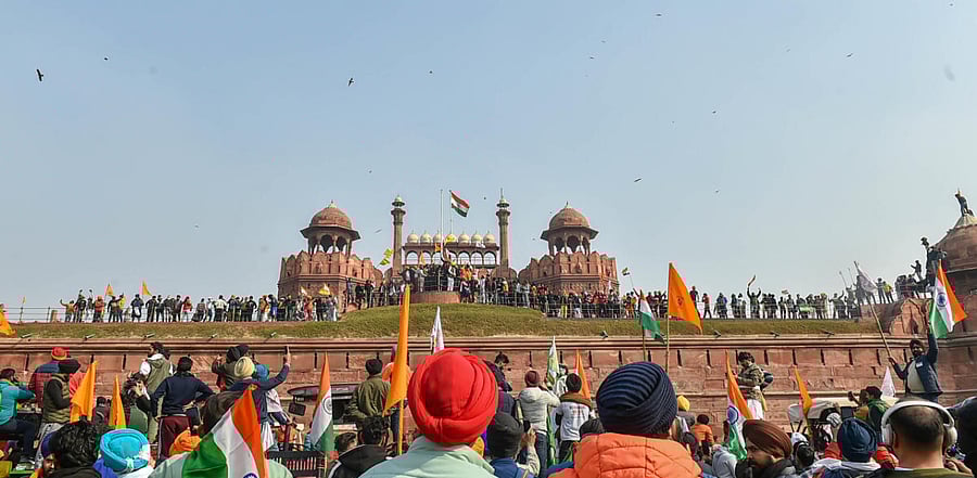 Farmers gather at Red Fort during their tractor parade on Republic Day, in New Delhi. Credit: PTI Photo