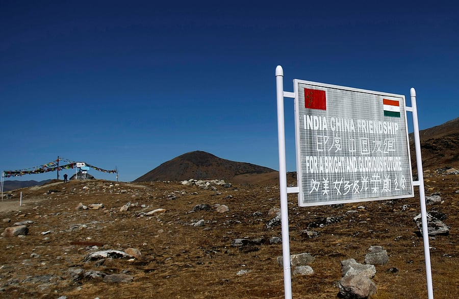A signboard is seen from the Indian side of the Indo-China border at Bumla, in Arunachal Pradesh. Credit: REUTERS Photo