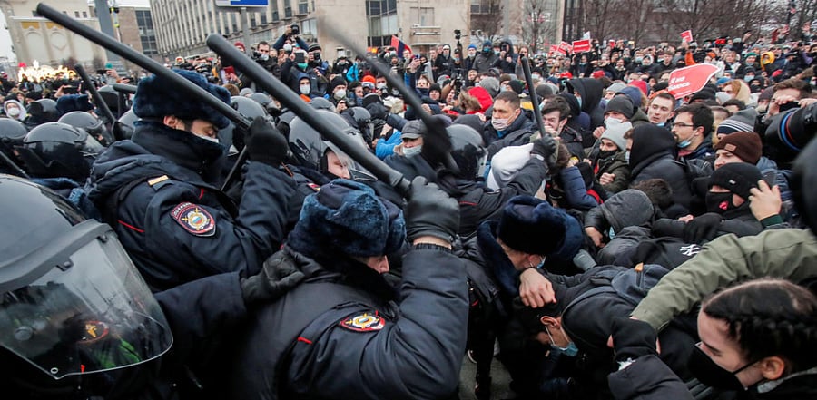 Law enforcement officers clash with participants during a rally in support of jailed Russian opposition leader Alexei Navalny in Moscow, Russia. Credit: Reuters Photo