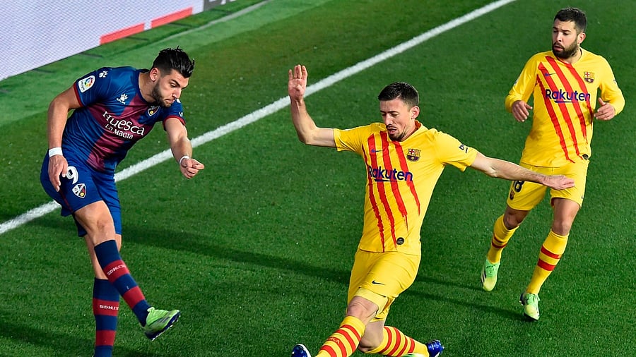 Huesca's Spanish forward Rafa Mir (L). Credit: AFP File Photo