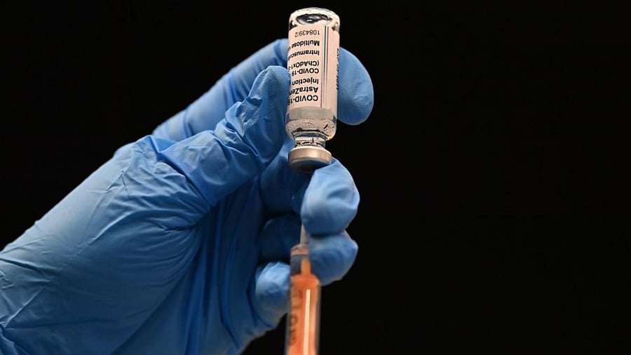 A healthcare professional draws up a dose of the Oxford/AstraZeneca Covid-19 vaccine at the vaccination centre set up inside Brighton Centre in Brighton, southern England, on January 26, 2021. Credit: AFP Photo