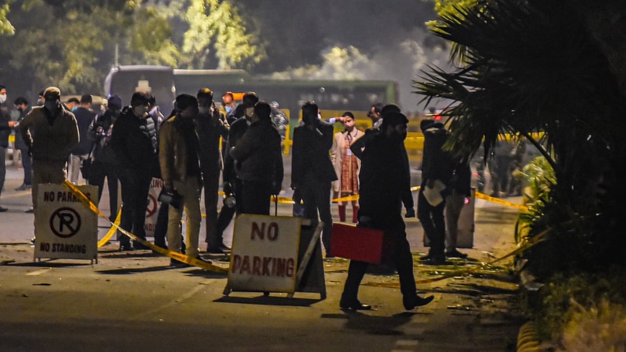 Security personnel inspect the area after a low intensity blast outside the Israeli Embassy, in New Delhi. Credit: PTI File Photo