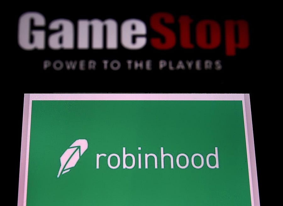 In this file photo illustration taken on January 28, 2021, shows the logos of video grame retail store GameStop and trading application Robinhood in a computer and on a mobile phone in Arlington, Virginia. Credit: AFP.