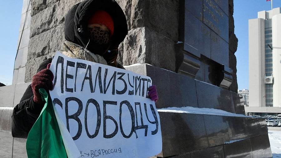 A demonstrator holds a placard reading "Legalize freedom" during a rally in support of jailed Russian opposition leader Alexei Navalny in Vladivostok, Russia January 31, 2021. Credit: Reuters Photo
