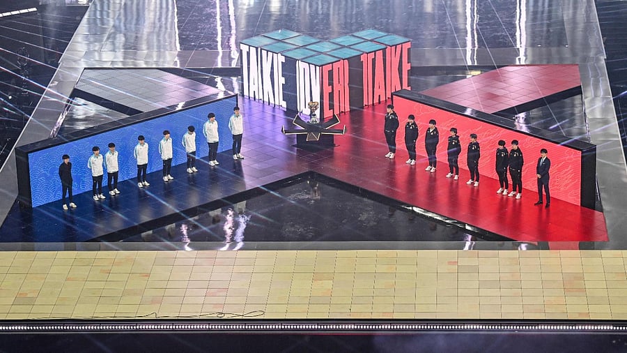 China's Suning team (R) and South Korea's Damwon team attending the opening ceremony of the League of Legends World Video Game Championships Final at SAIC Pudong Football Stadium in Shanghai. Credit: AFP File Photo