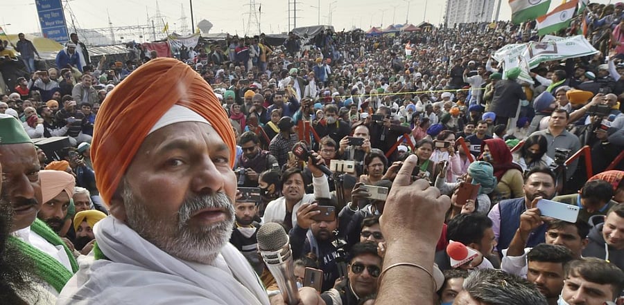 Bharatiya Kisan Union (BKU) spokesperson Rakesh Tikait addresses during a protest over Centre's farm reform laws, at Ghazipur border in New Delhi. Credit: PTI Photo