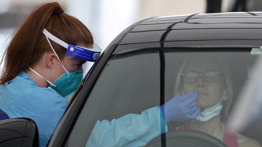 A medical worker swabs a member of the public at the Bondi Beach drive-through coronavirus disease (COVID-19) testing centre as the city experiences an outbreak in Sydney, Australia, December 21, 2020. Credit: Reuters File Photo