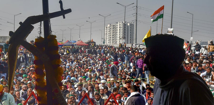  Farmers during their ongoing agitation against Centre's farm reform laws, at Ghazipur border in New Delhi. Credit: PTI Photo