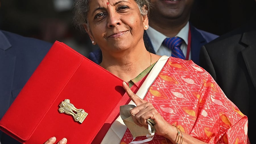 Finance Minister Nirmala Sitharaman gestures as she leaves the Finance Ministry to present the annual budget. Credit: AFP Photo