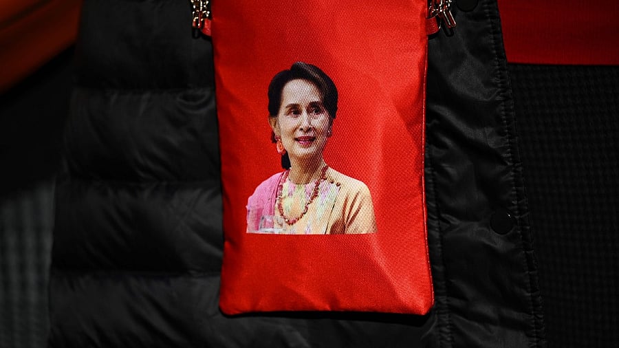A portrait of Myanmar's de facto leader Aung San Suu Kyi is seen on a bag as Myanmar activists protest outside the United Nations university building in Tokyo on February 1, 2021 following a military coup in the country by a general after arresting civilian leader Aung San Suu Kyi and other senior officials. Credit: AFP Photo