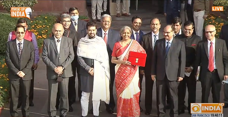 Finance Minister Nirmala Sitharaman with MoS Anurag Thakur, officials outside the Parliament ahead of the Budget speech. Credit: PTI Photo