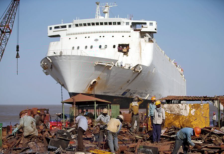 Workers sort out metal scrap of a decommissioned ship at the Alang shipyard in the western state of Gujarat, India, May 28, 2018. Picture taken May 28, 2018. REUTERS/Amit Dave