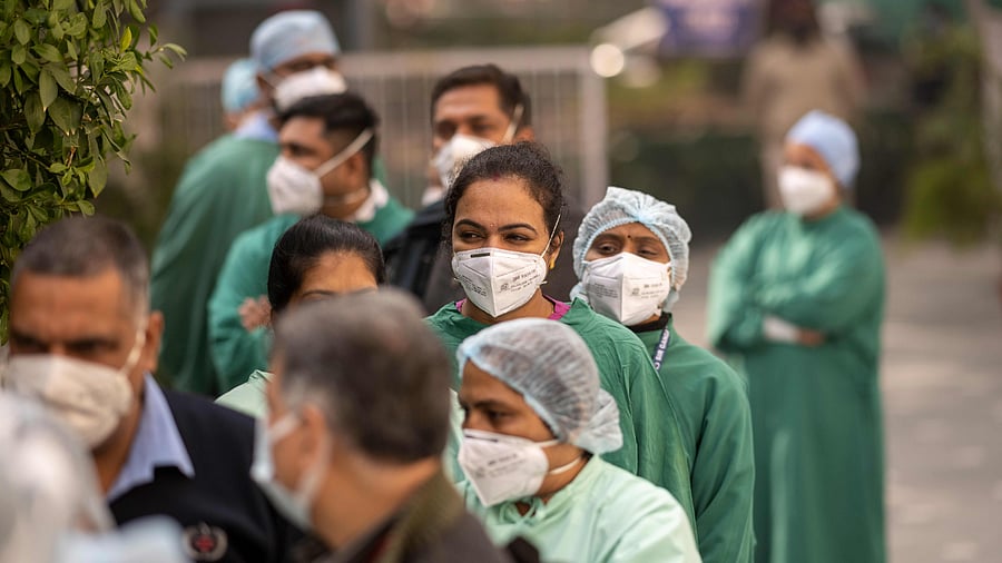 Medical workers wait to be inoculated with a Covid-19 coronavirus vaccine at a hospital in New Delhi. Credit: AFP Photo