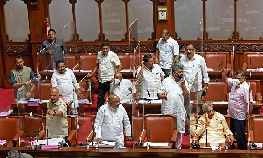 Congress leaders stage a walkout in the Legislative Council on Thursday. DH photo/M S Manjunath