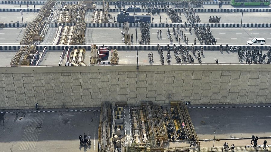Barricades set up at Delhi-UP Ghazipur border to stop farmers from marching towards the national capital, during their ongoing agitation against Centre's farm reform laws, in New Delhi. Credit: PTI.