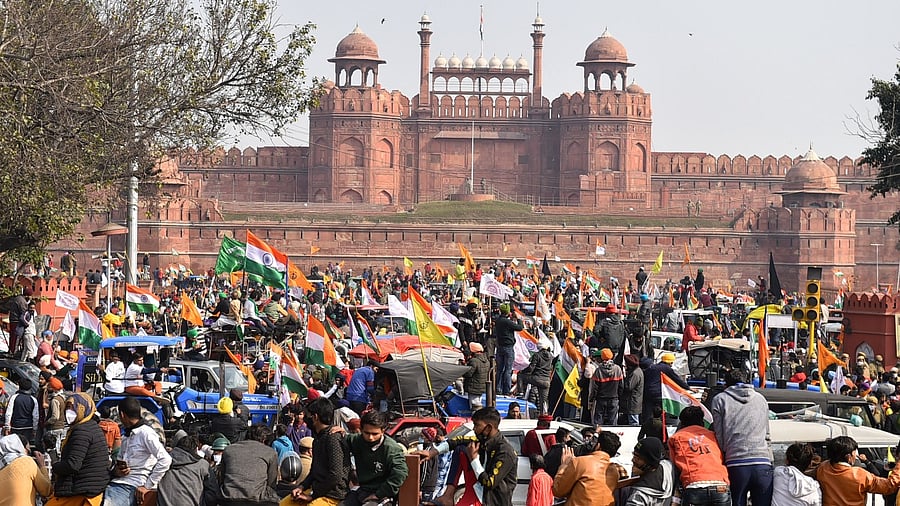 Farmers gather at Red Fort during their tractor parade on Republic Day, in New Delhi. Credit: PTI Photo