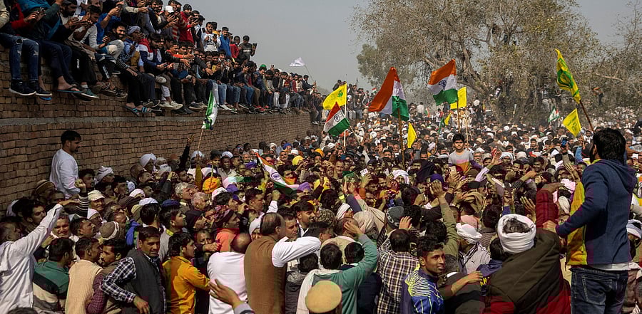People attend a Maha Panchayat or grand village council meeting as part of a farmers' protest against farm laws at Kandela village in Jind district. Credit: Reuters Photo