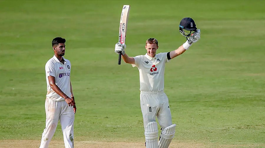 England's Joe Root raises his bat after scoring a century during Day 1 of the first cricket test match between India and England, at MA Chidambaram Stadium in Chennai. Credit: PTI photo. 