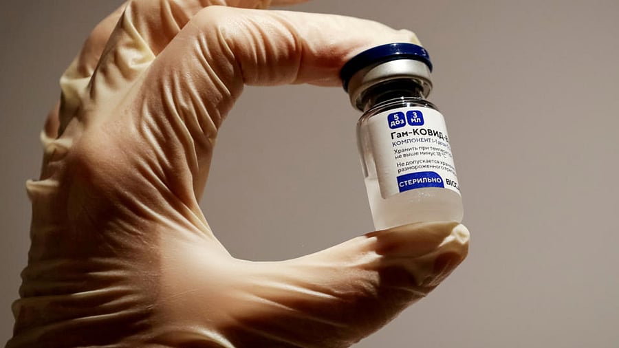  A medical specialist holds a vial of Sputnik V vaccine against the coronavirus in a department store in Moscow, Russia, January 18, 2021. Credit: Reuters File Photo